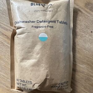 Blue land dishwasher pods and tin